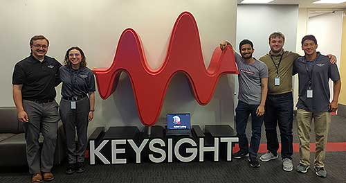 Vineet in front of Keysight signage